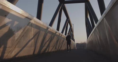 Adult man running athlete sprinting workout challenge training endurance in urban city