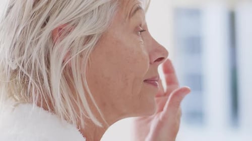 Woman Applying Face Cream for Skincare