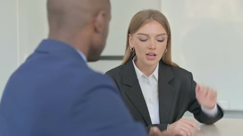 Business Meeting with Woman and Man in Suits