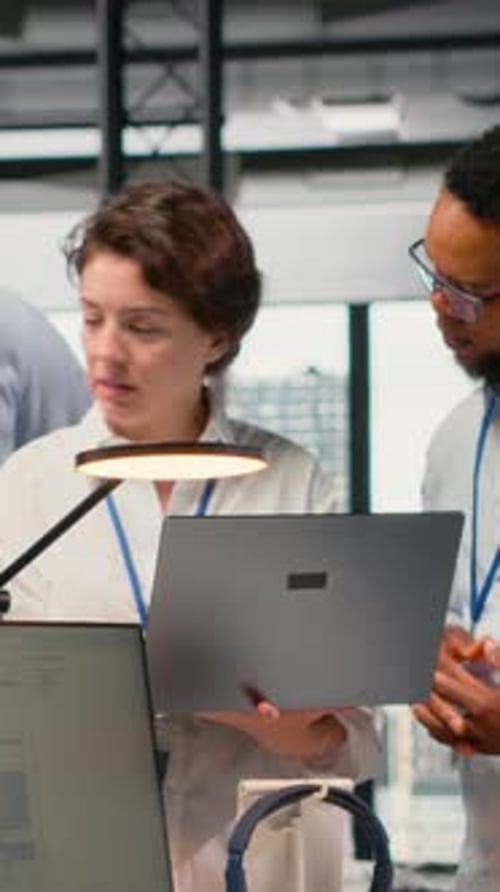 Vertical Video Engineering Team Working Together in Office Using AI Specialized Hardware