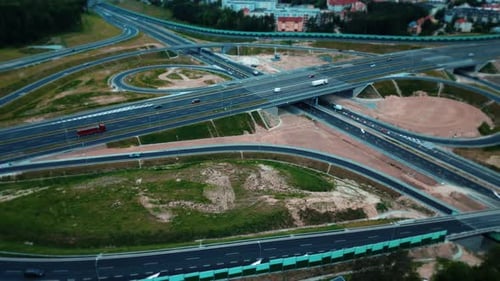 Aerial view of the road junction at the intersection of suburban highways. Transport infrastructure.