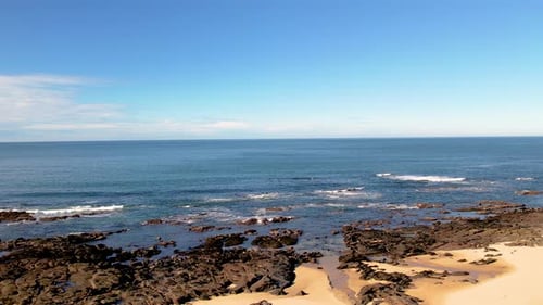 Aerial view of the shoreline during low tide