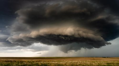 Dramatic Storm Clouds over Golden Field, Rural Landscape