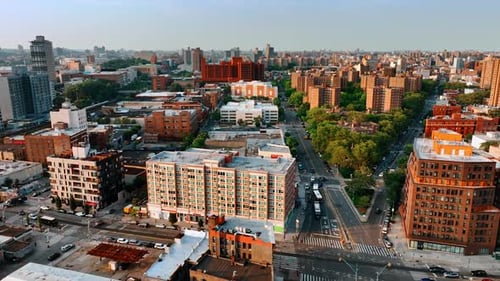 Neighborhoods of New York on sunny daytime. Top view on the residential areas at sunset.