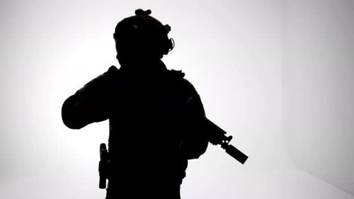 Soldier Silhouette Holds an Assault Rifle