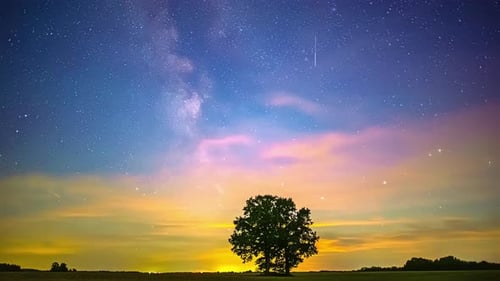 Timelapse view of milky way galaxy appearing on sky during nighttime full of stars.