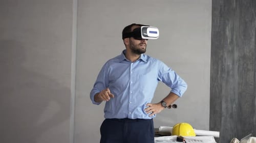 Man Wearing VR Headset Standing Indoors