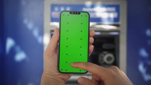 Person Withdraw Money From an ATM Without Using Card Holding a Phone with Green Screen Using App for