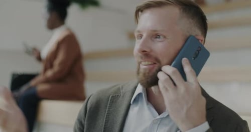Man in Blazer Talking on Cell Phone Smiling