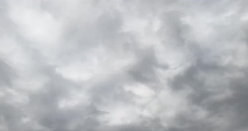 Dramatic cloudscape forming in the skies. Rainy clouds move in the atmosphere. Low angle view.