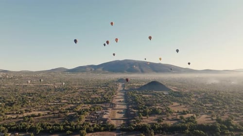 Aerial Shot Of Teotihuacan City of Gods, Aztec Pyramids, Hot Air Balloons In Background, Mexico
