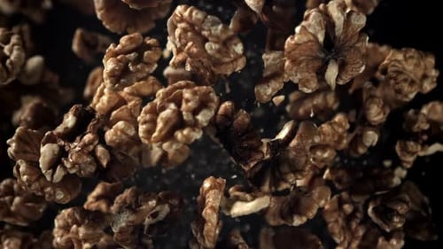 Peeled Walnuts Floating in Slow Motion