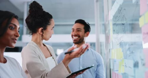 Excited Team Brainstorming Together in Modern Office
