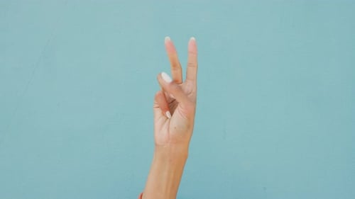 Communication, sign language and a countdown on a hand with blue background