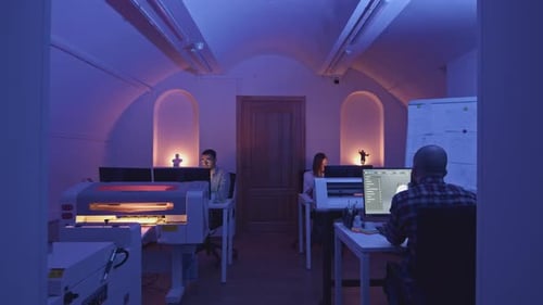 Modern Creative Office with Employees at Computers Media Small Team of Creative Freelancers in Neon