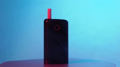 Sleek Electronic Device on Display with Dynamic Lighting