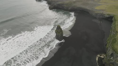 Aerial view of black sand beach in Iceland in winter.