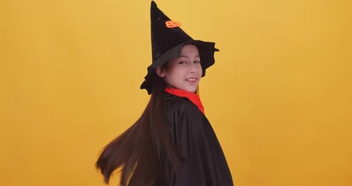 Happy Child Dancing in Halloween Costume