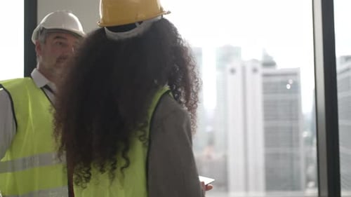 Engineers work in high rise building.