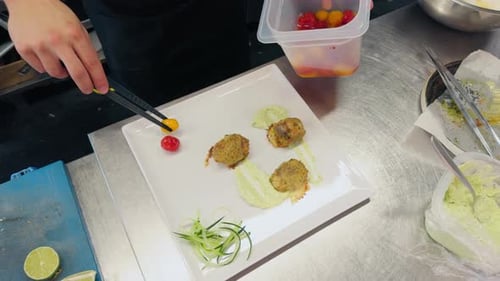 Chef Plating Delicious Food in a Professional Kitchen