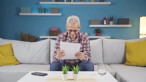 Adult Reading Good News on Sofa Inside Home