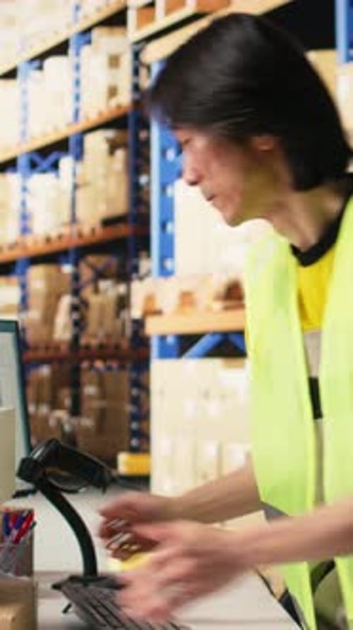 Vertical Video Warehouse Worker Scanning Airway Bills Labels Applied on Cargo Packages