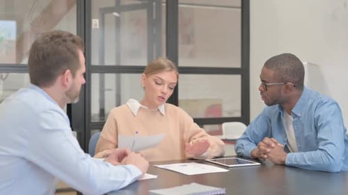 Business Team Having a Discussion in the Office