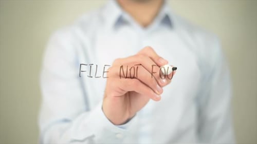 Man Writes "File Not Found" on Clear Surface