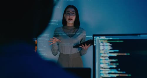 Adult Asia female software developer mentor leader manager talk strategy plan to executive.