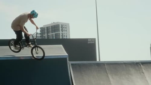 Youth Jumps and Performs Stunts on Bike