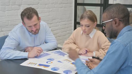 Team Examines Graphs Together in the Workplace