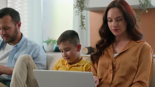 Family Using Technology Together in Living Room