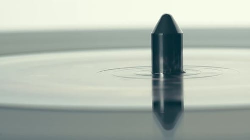 Black Retro vinyl record player Rotating. Macro. View from above. Spinning vinyl plate