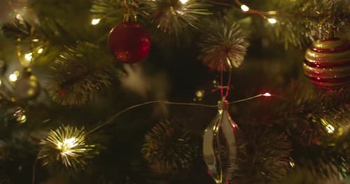 Happy New Year Christmas Tree Decorates on Branch Snow on Background Bokeh of Side Flickering Light