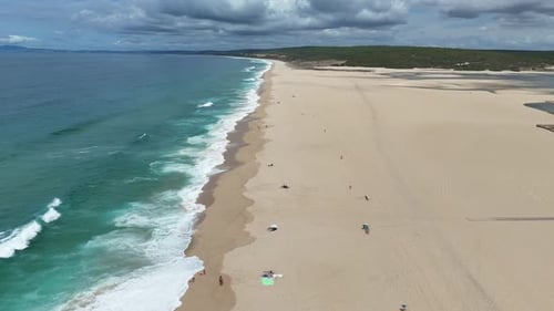 A Stunning Aerial View Showcasing a Beautiful Beach with Crystal Clear Waters and Soft Fine Sand