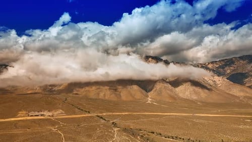 Massive cloudscape coating the tops of the mountains in Death Valley.