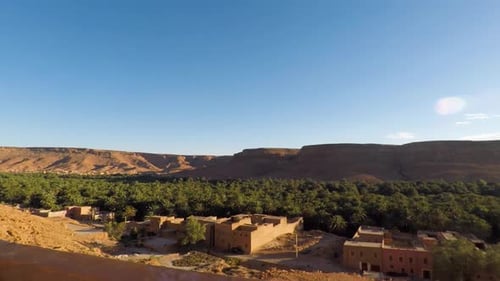 Beautiful green oasis in middle of valley from Atlas Mountain range