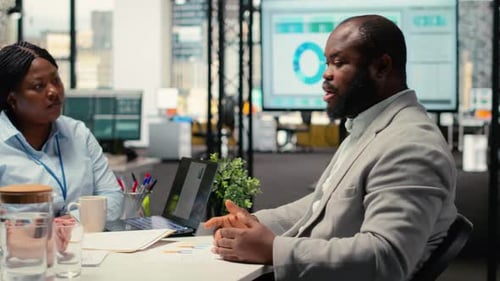 Business team meeting at conference table indoors