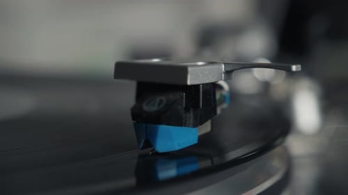 Closeup View of a Stylus on a Spinning Vinyl Record