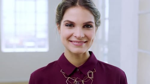 Woman Smiling in a Maroon Shirt Close-Up