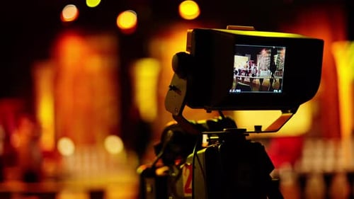 Professional camera filming with on the backstage of a TV set