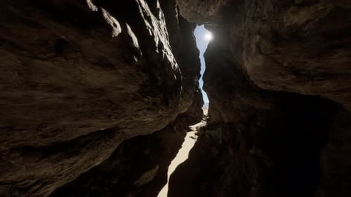 A Narrow Passage in a Cave with Sunlight Coming Through