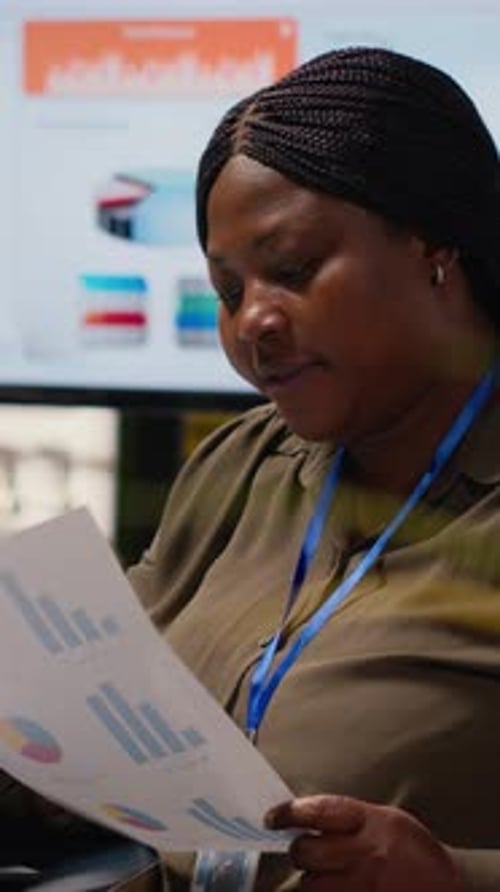 Vertical Video Black Ambitious Entrepreneur Types Information at Her Workstation