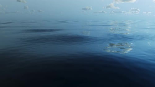 Landscape: calm sea and clouds in the background.