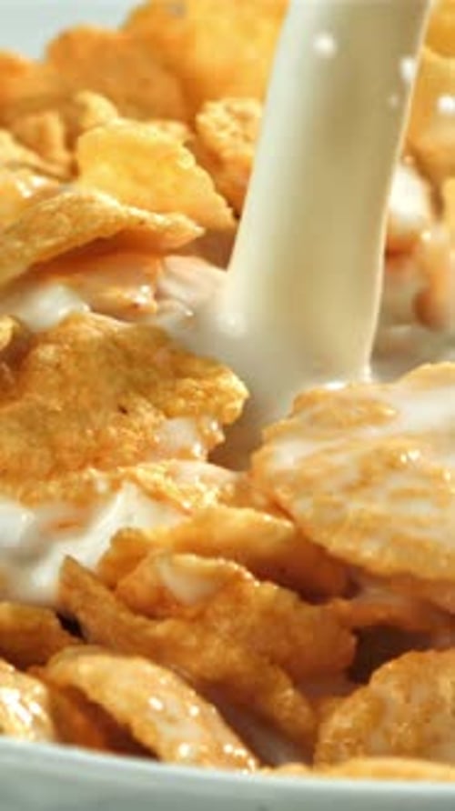 Milk is Poured Into a Cup of Cornflakes Filmed on a Highspeed Camera at 1000 Fps