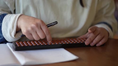 woman using abacus