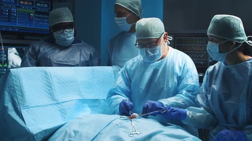 Surgeons Performing Operation in Hospital Operating Room