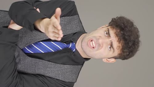 Man Gesturing and Talking in Vertical Format