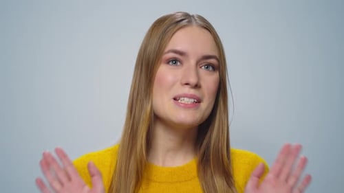 Portrait Displeased Woman Gesturing Stop Sign with Hands in Studio. Closeup Young