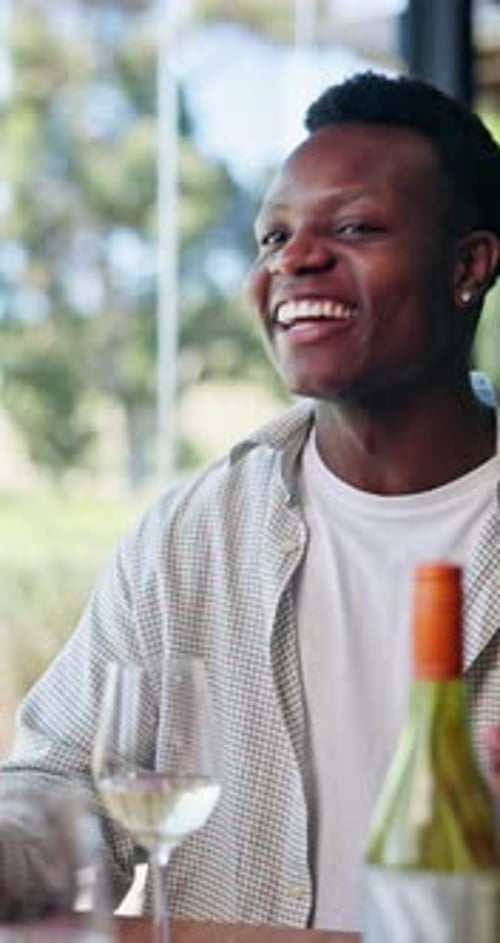 Toast, friends and man in restaurant with alcohol for social gathering, reunion